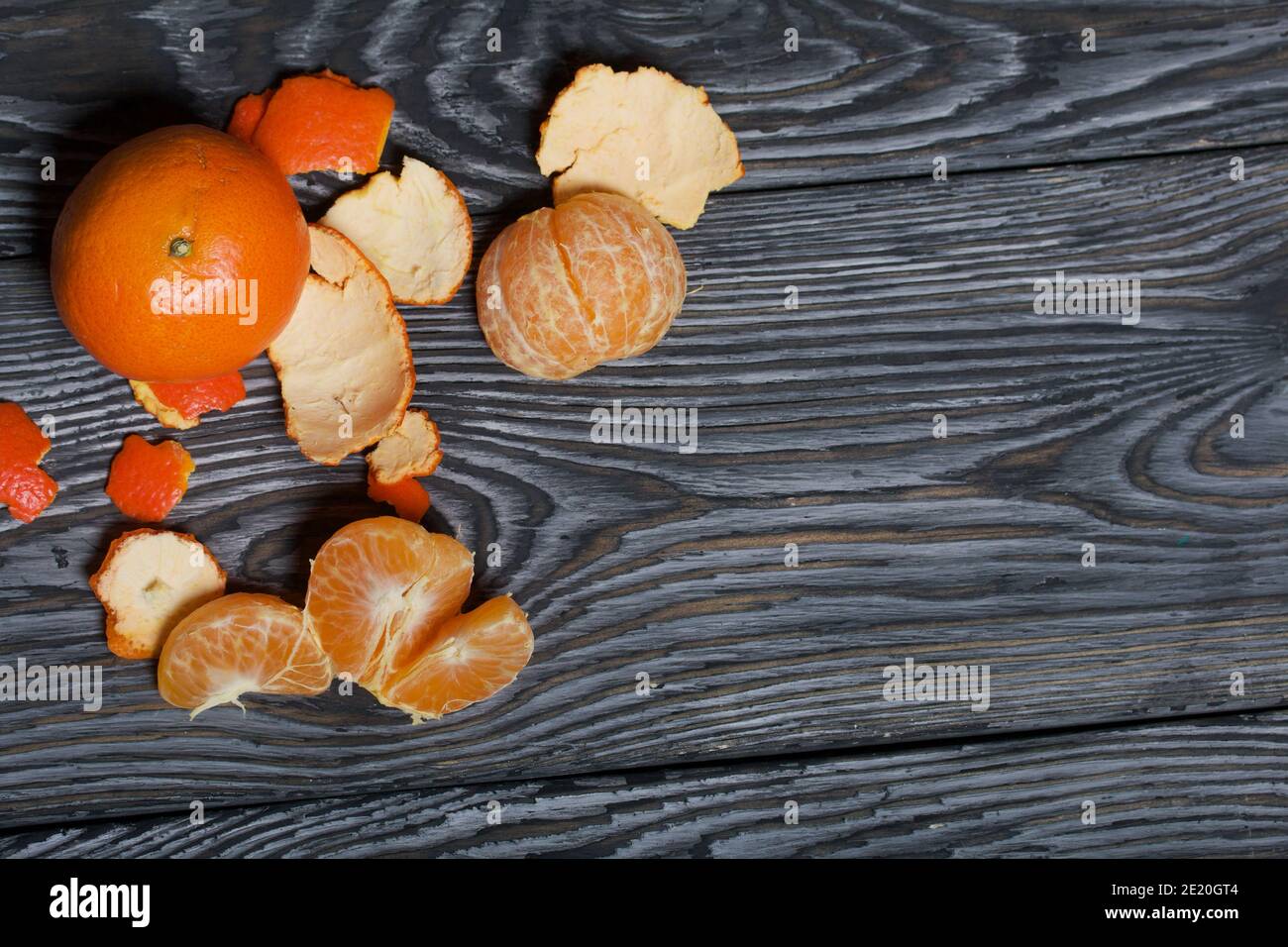 Orange tangerines. One of them is peeled. Close-up shot Stock Photo - Alamy