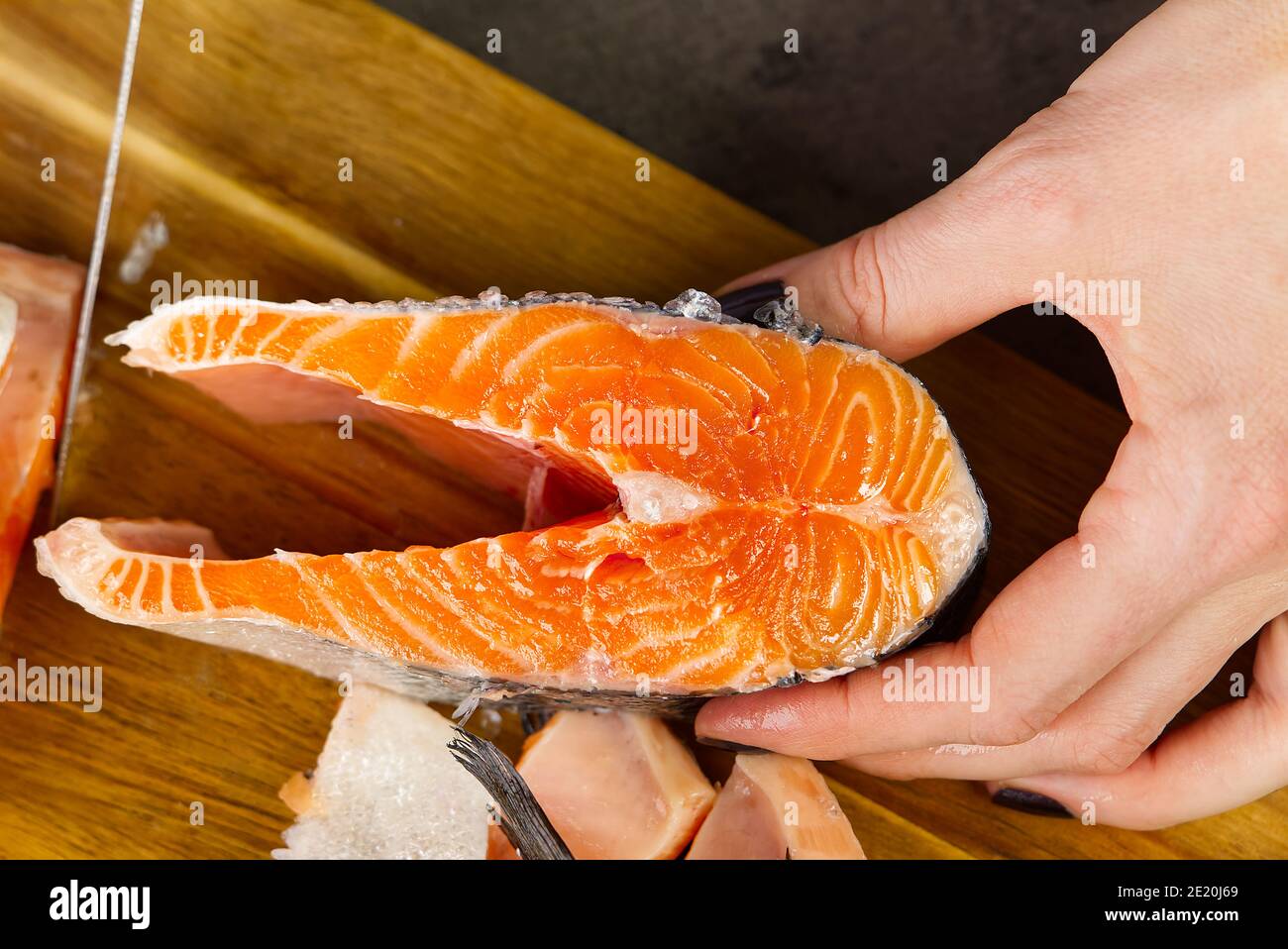 Cutting salmon fresh fish for dinner. diy cooking at home Stock Photo