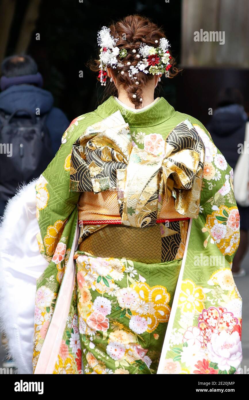 Tokyo, Japan. 11th Jan, 2021. A Japanese girl dressed in colorful kimono is  seen on the street during the Coming of Age Day. The Coming of Age Day  (Seijin-no-Hi) is a holiday