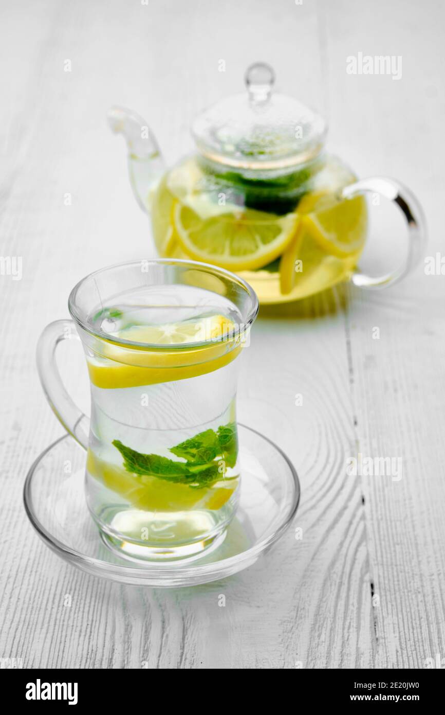 Antioxidant hot drink with lemon and mint in transparent tea pot and glass Stock Photo Alamy