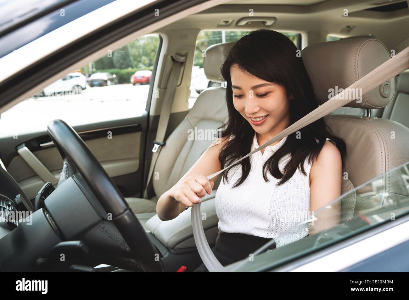 Woman wearing seat belt hi-res stock photography and images - Alamy