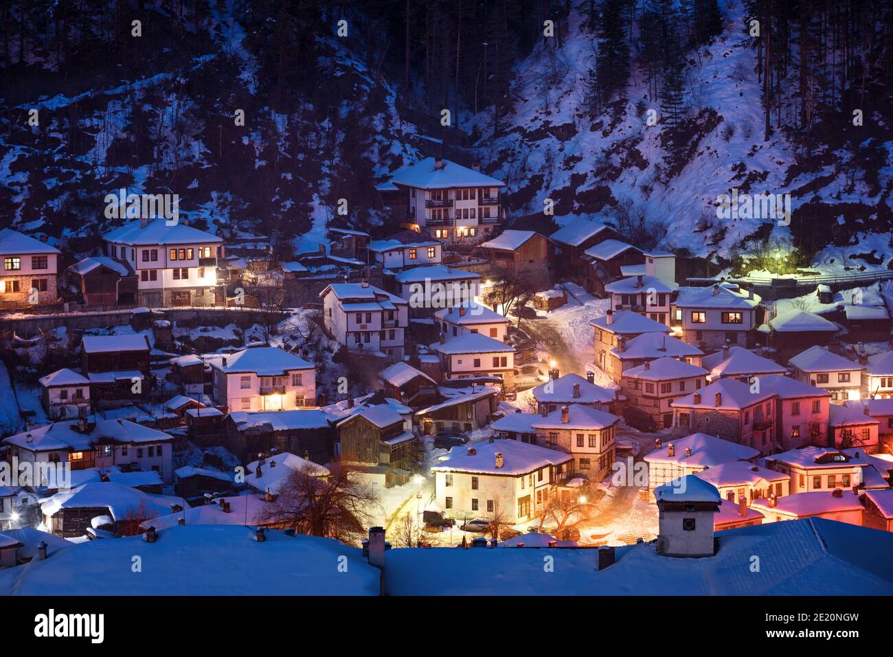 Snowy fairytale in Bulgaria. Night goes down over Shiroka Laka village, Bulgaria Stock Photo