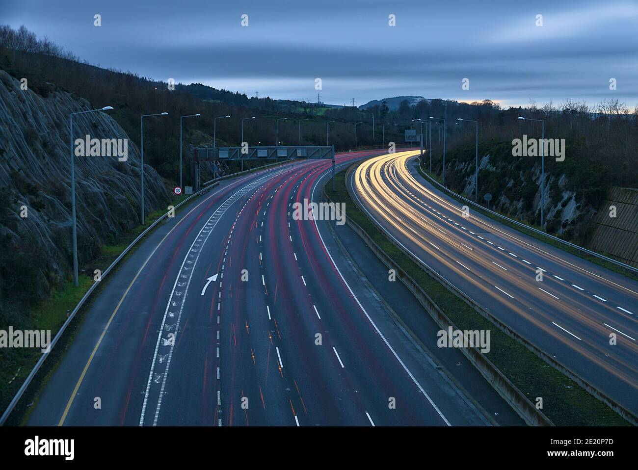 Beautiful very long exposure evening view of light trails of vehicles on motorway M50 Dublin, Ireland. Transportation during Level 5 in Dublin Stock Photo