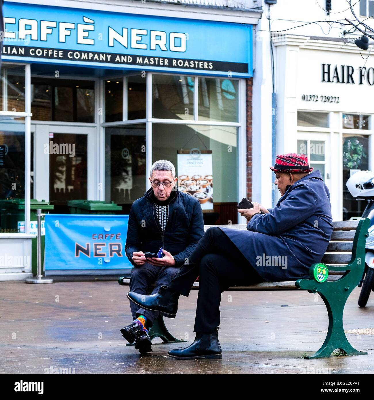 London UK, Two Senior Older Men Sitting Outside A Cafe Nero Coffee Shop  Relaxing And Talking Stock Photo - Alamy