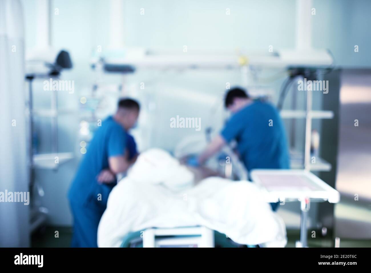 Professional life rescue in hospital, unfocused background. Stock Photo