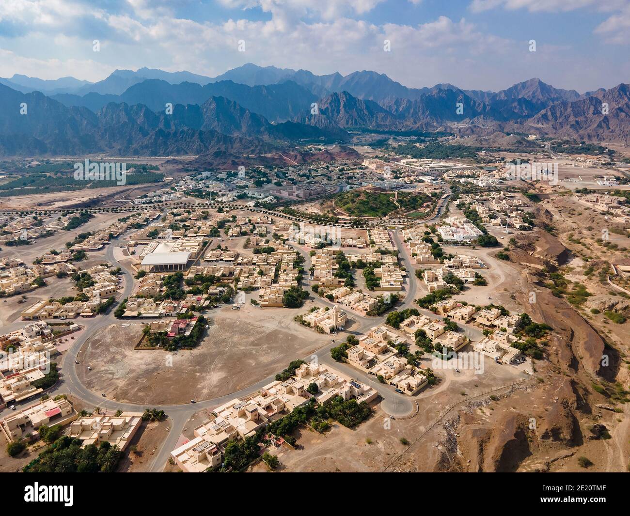 Hatta town aerial cityscape surrounded by Hajar mountains in Hatta enclave of Dubai in the United Arab Emirates aerial view Stock Photo