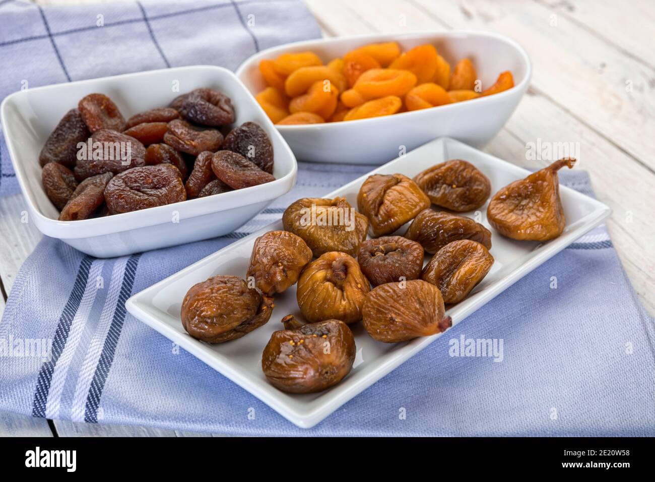 Variety of dried fruit in bowls on table Stock Photo