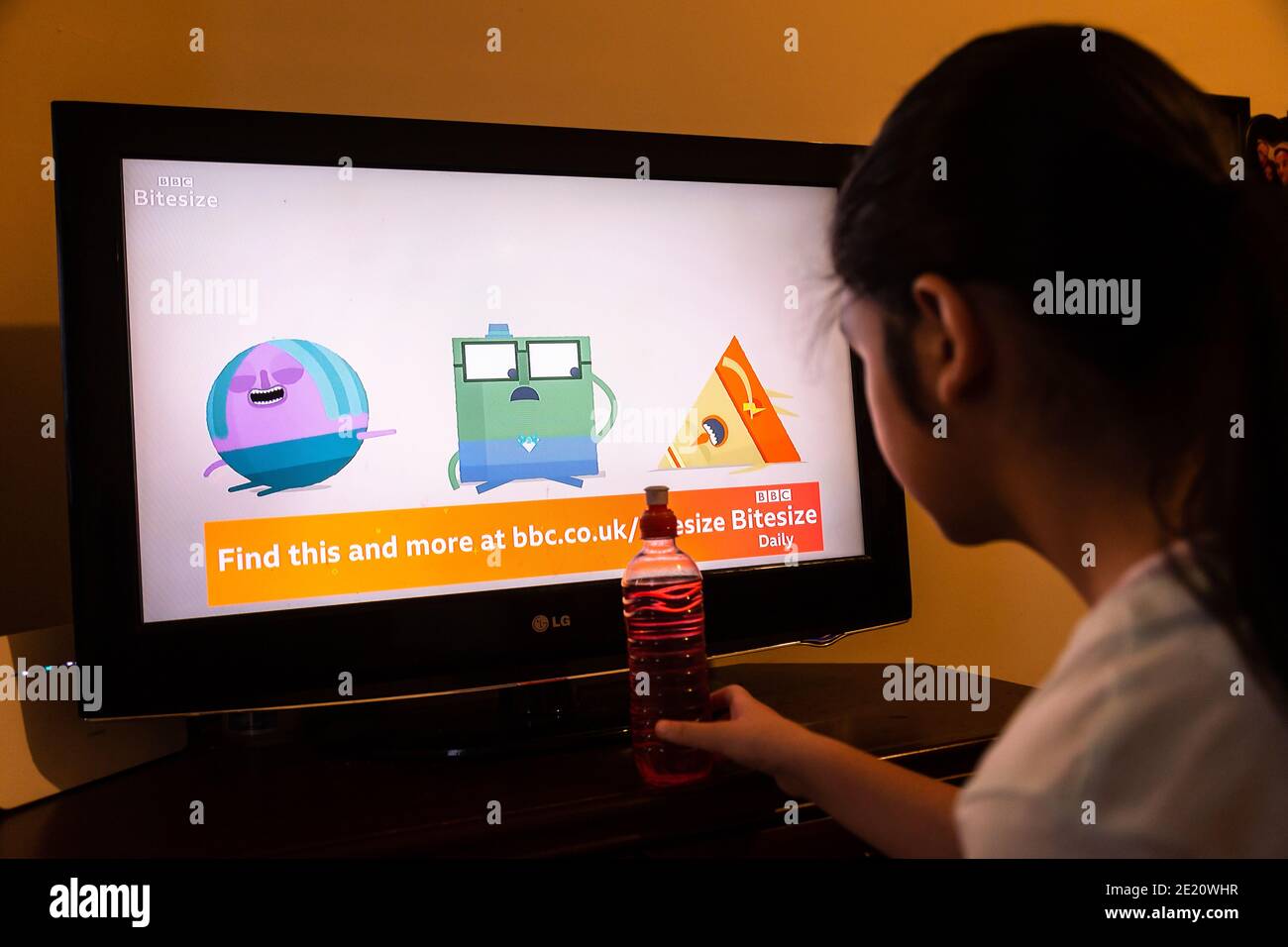 Old Hill, West Midlands, UK. 11th Jan, 2021. 10-year-old Ellie-May Pearson of Old Hill, West Midlands, watches the opening programme of the BBC's new Lockdown Learning service. The new TV service which launched this morning is committed to bringing hundreds of educational resources together to help with home schooling as schools are limiting its pupils to children of key workers and vulnerable children. Credit: Peter Lopeman/Alamy Live News Stock Photo