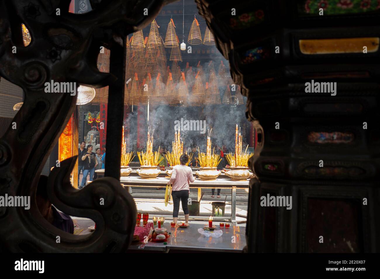 Incense burning in large pots in a Buddhist temple in Vietnam Stock Photo