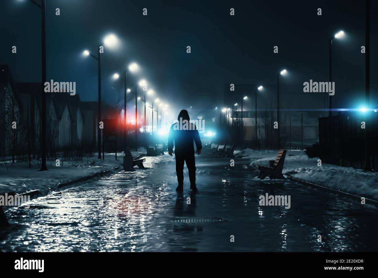 Man silhouette in misty alley at night city park, mystery and horror foggy cityscape atmosphere, alone stalker or crime person. Stock Photo