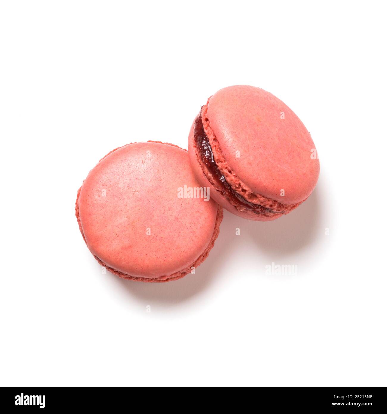 Raspberry flavor macarons top view isolated on white background Stock Photo