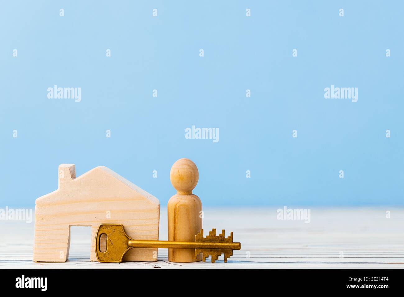 Wooden toy house and house keys close up Stock Photo