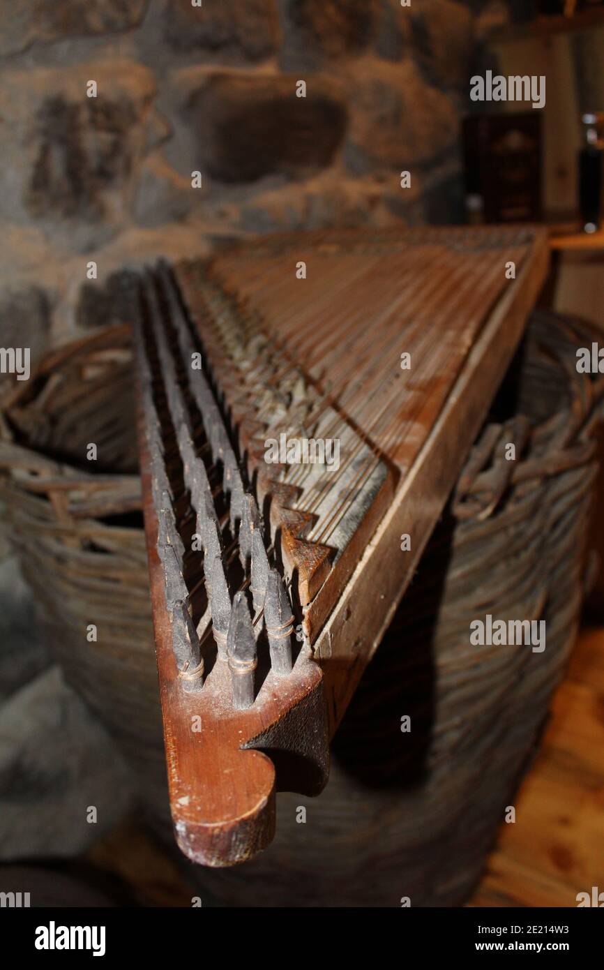 Vertical shot of a musical instrument called qanun put on a wicker
