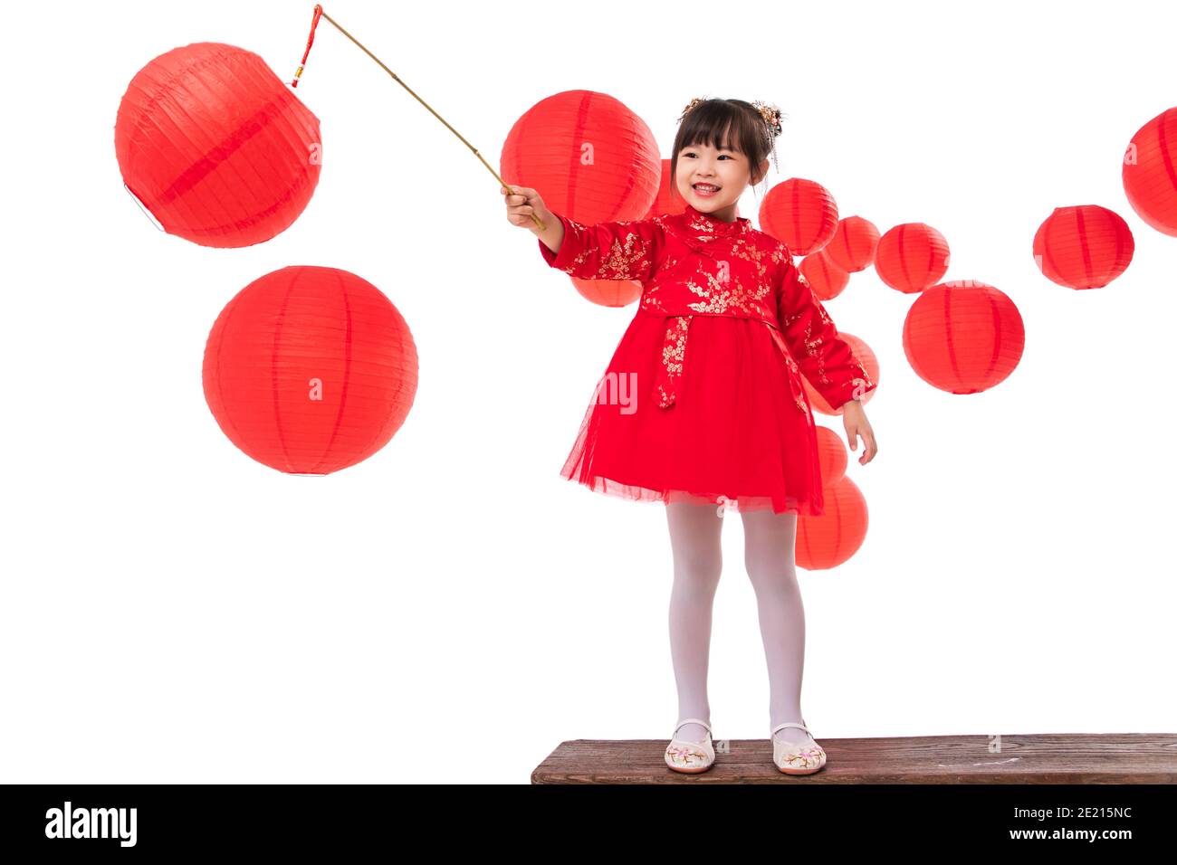 https://c8.alamy.com/comp/2E215NC/beside-the-red-lanterns-play-little-girl-carrying-a-lantern-2E215NC.jpg