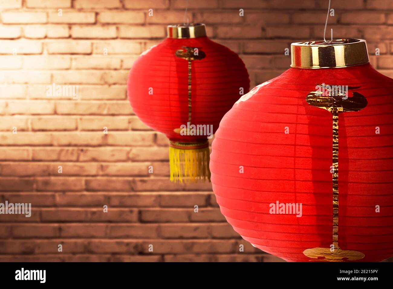 Chinese lanterns hanging with brick wall background Stock Photo - Alamy
