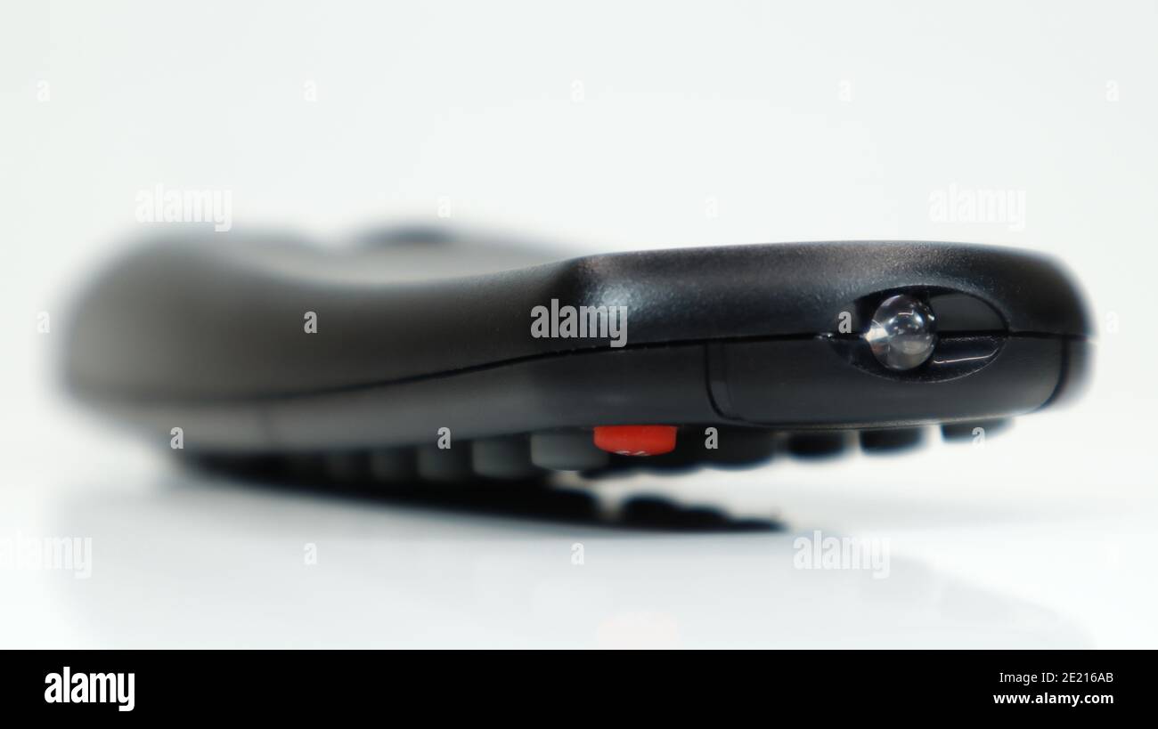 Remote control closeup. Black TV remote control with AAA alkaline