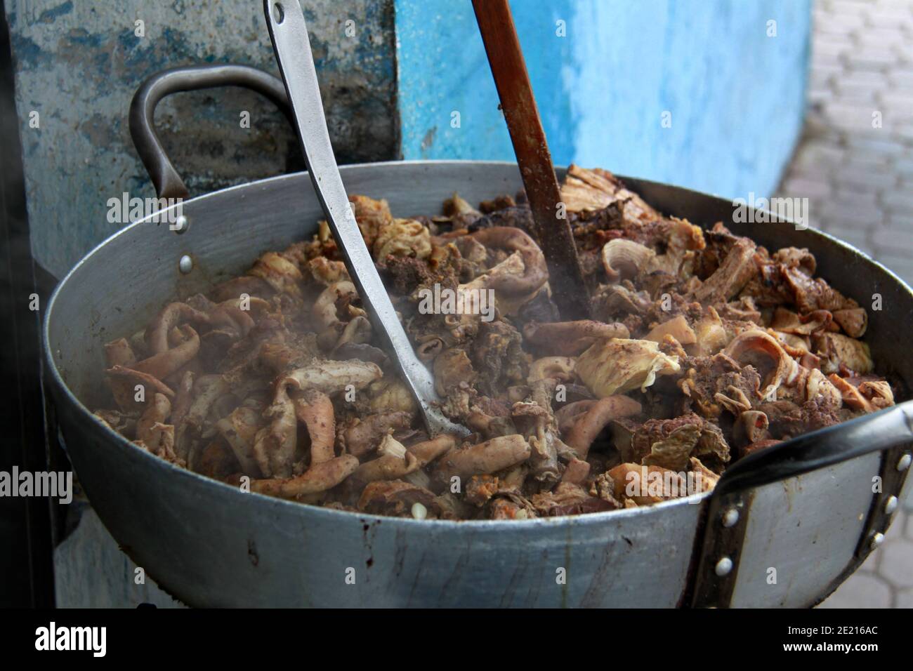 Typical meat dish for sale at the Otavalo market in Ecuador Stock Photo