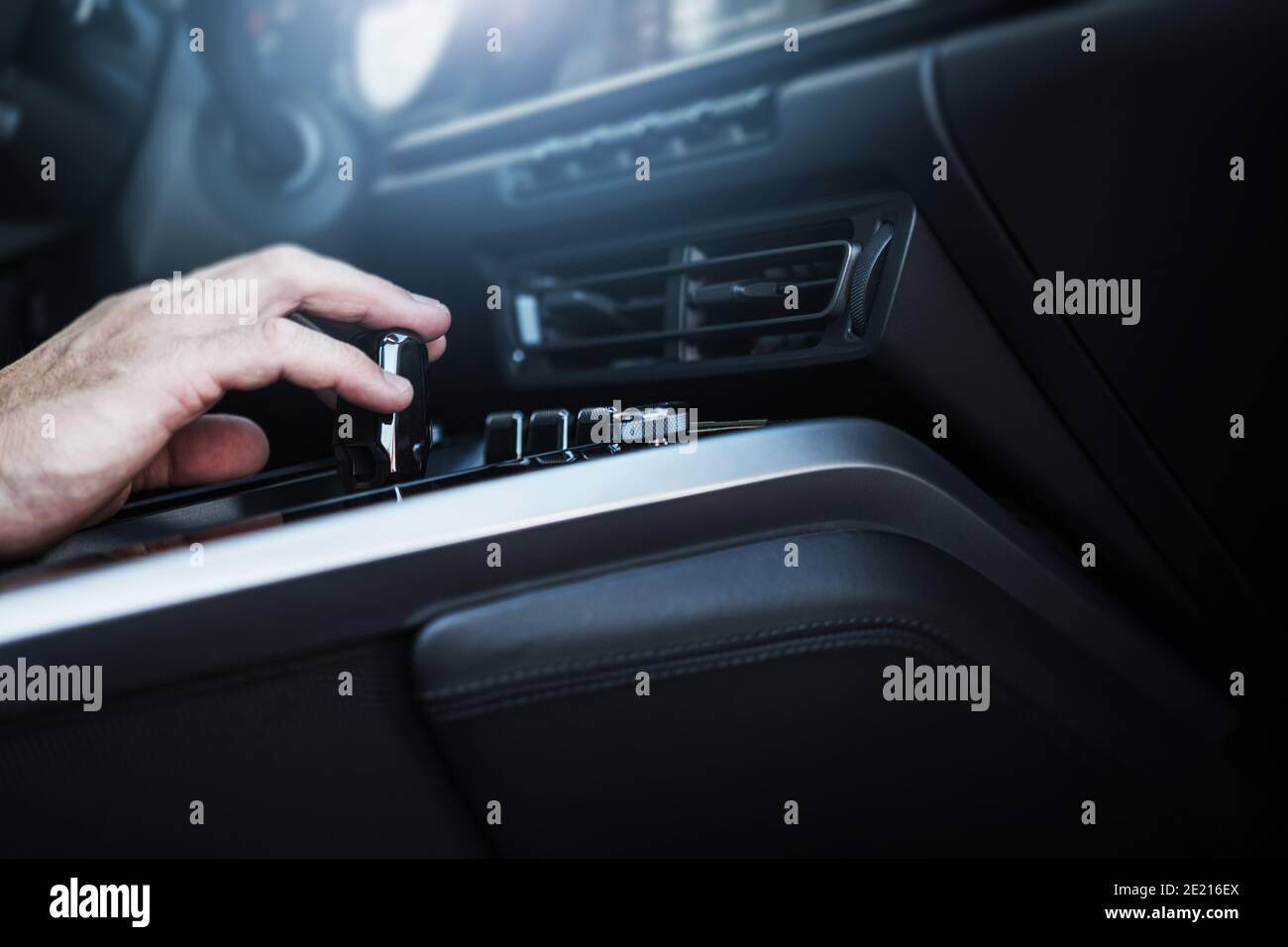 Caucasian Men Changing Automatic Transmission Gears in the Modern Car