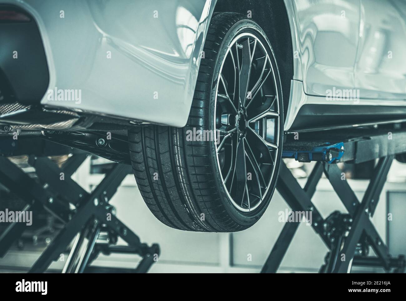Modern Vehicle Repaired in Authorized Service Center. Car on a Lift ...
