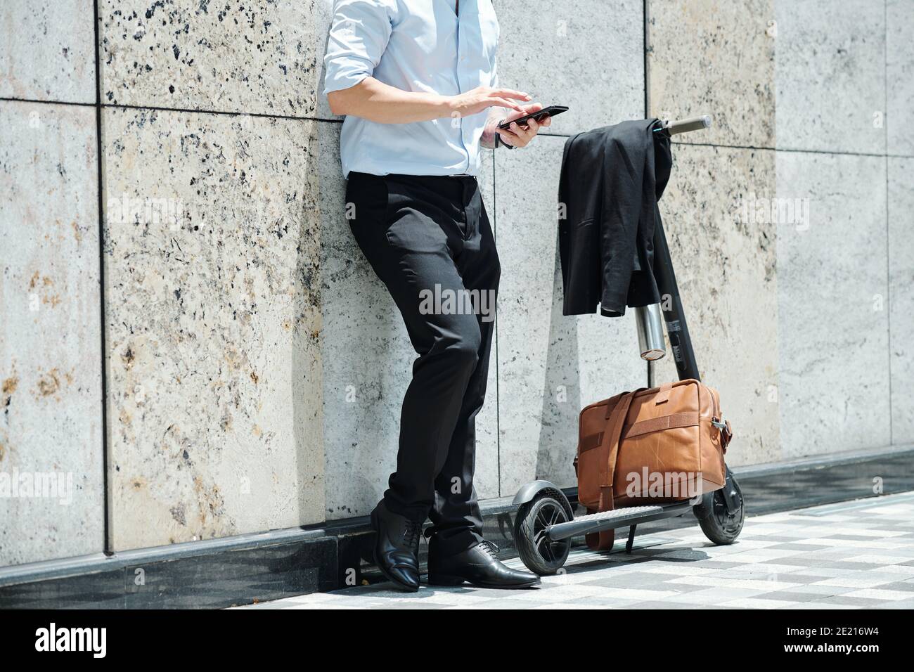 Businessman using app on smartphone Stock Photo