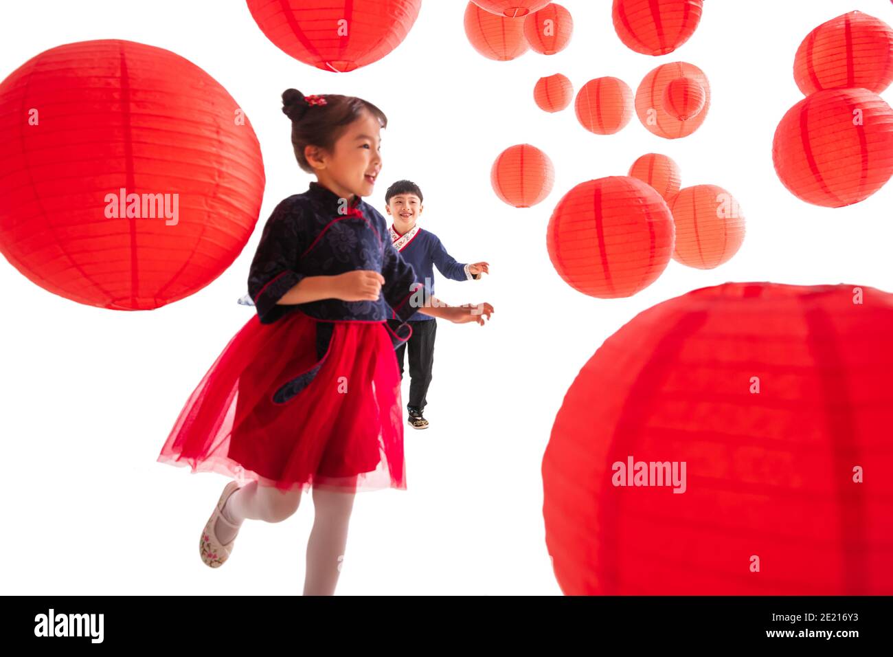 Boys and girls playing under the red lanterns Stock Photo