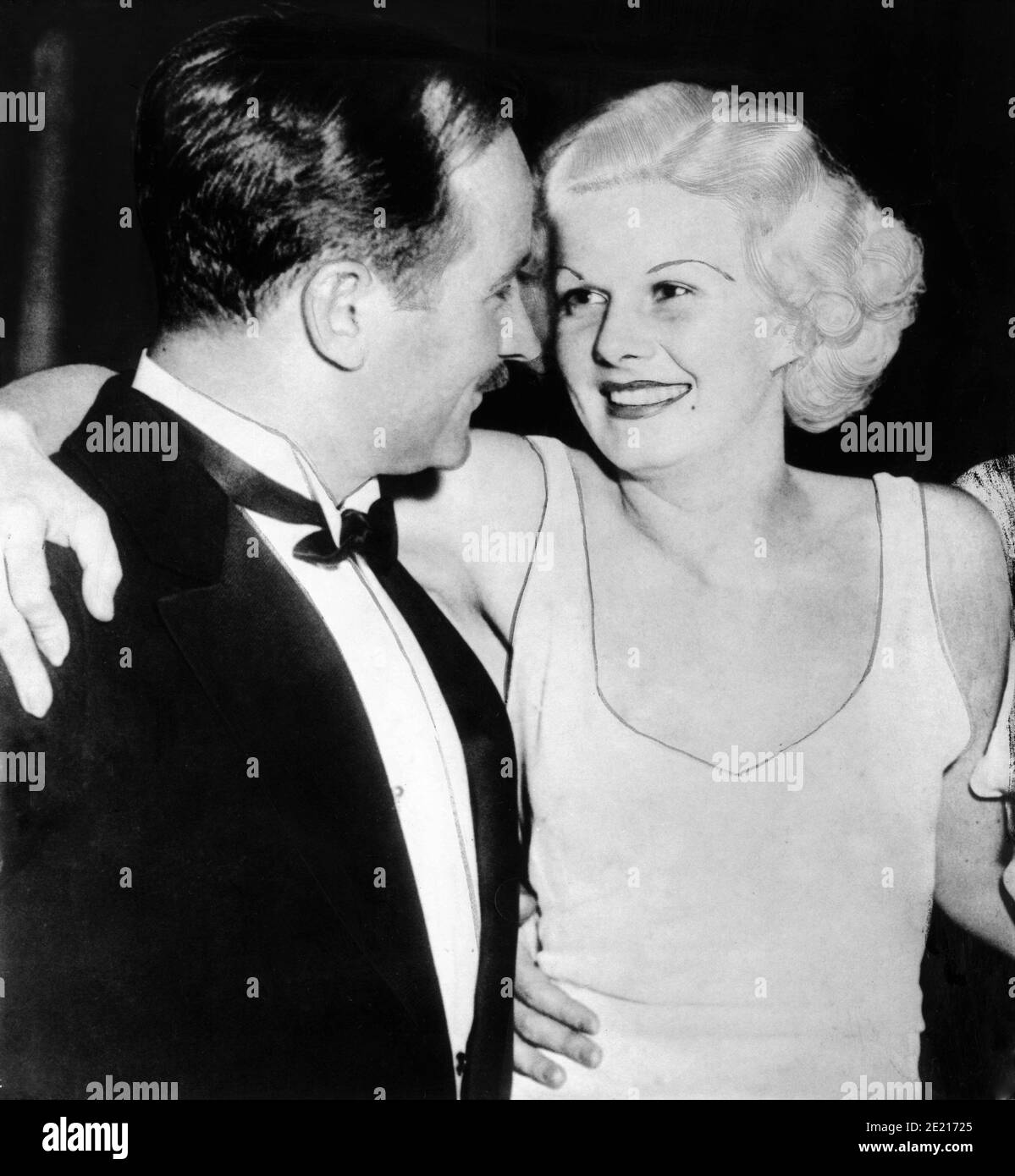 JEAN HARLOW with Cinematographer (and future 3rd Husband) HAROLD ROSSON outside The Cocoanut Grove nightclub in Hollywood June 4th 1933 Stock Photo