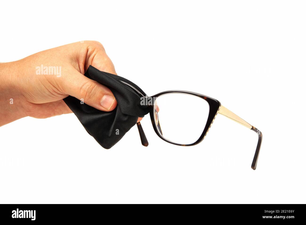 European woman hand cleaning rectangular eyeglass lens with black microfiber cloth isolated on