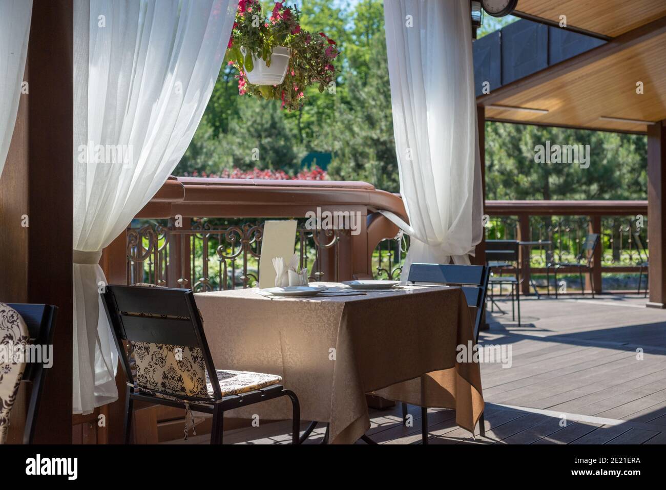 Summer cafe in Mezhyhirya park at Novi Petrivtsi near Kyiv, Ukraine Stock Photo