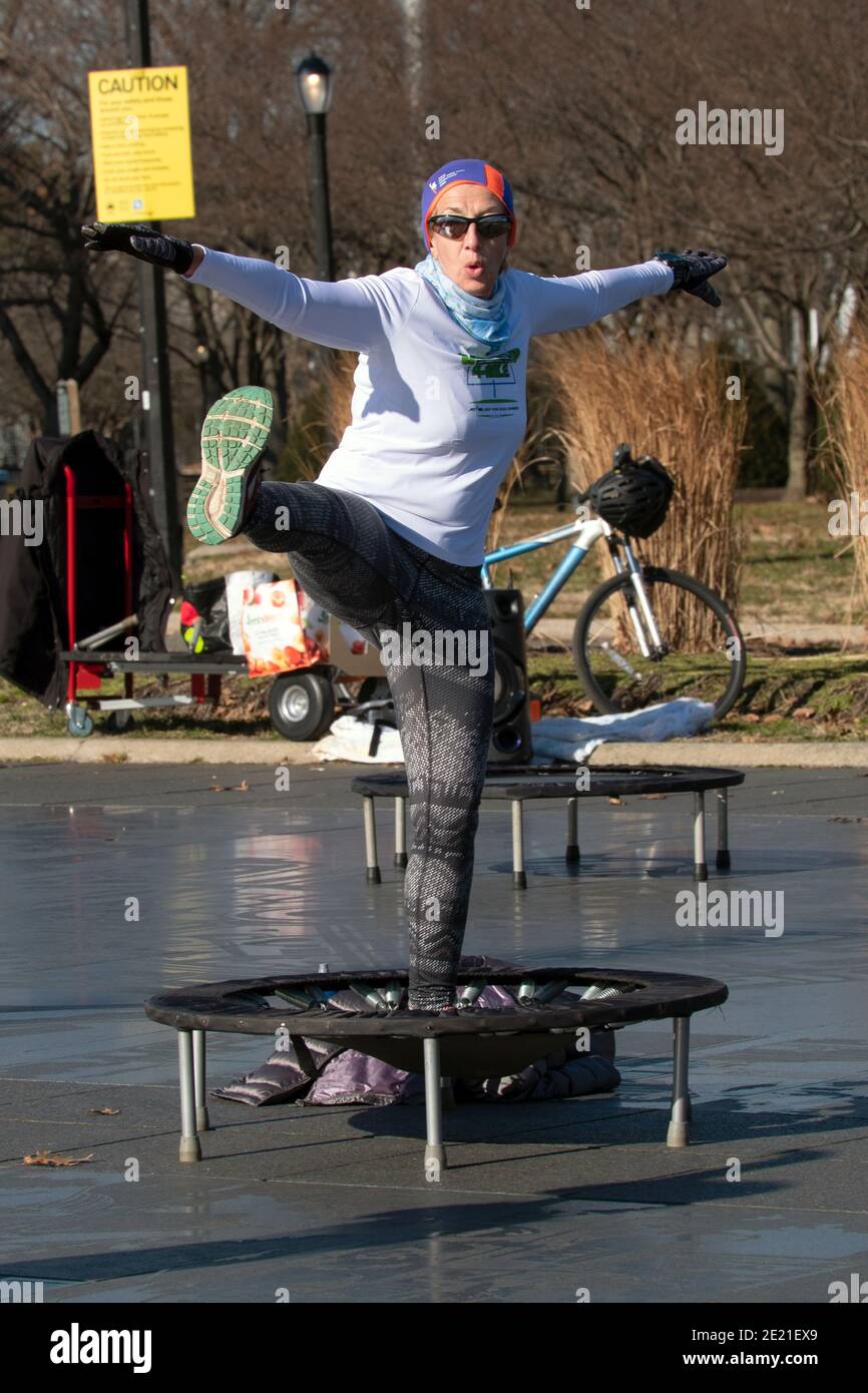 A woman at a rebounding class which combines vigorous movements while