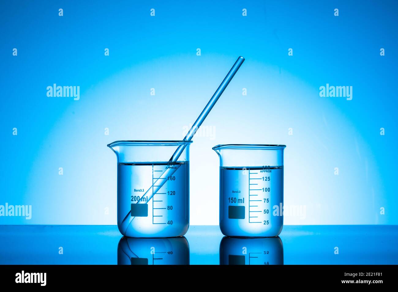 Two glass flasks with liquid on a lab tab Stock Photo - Alamy