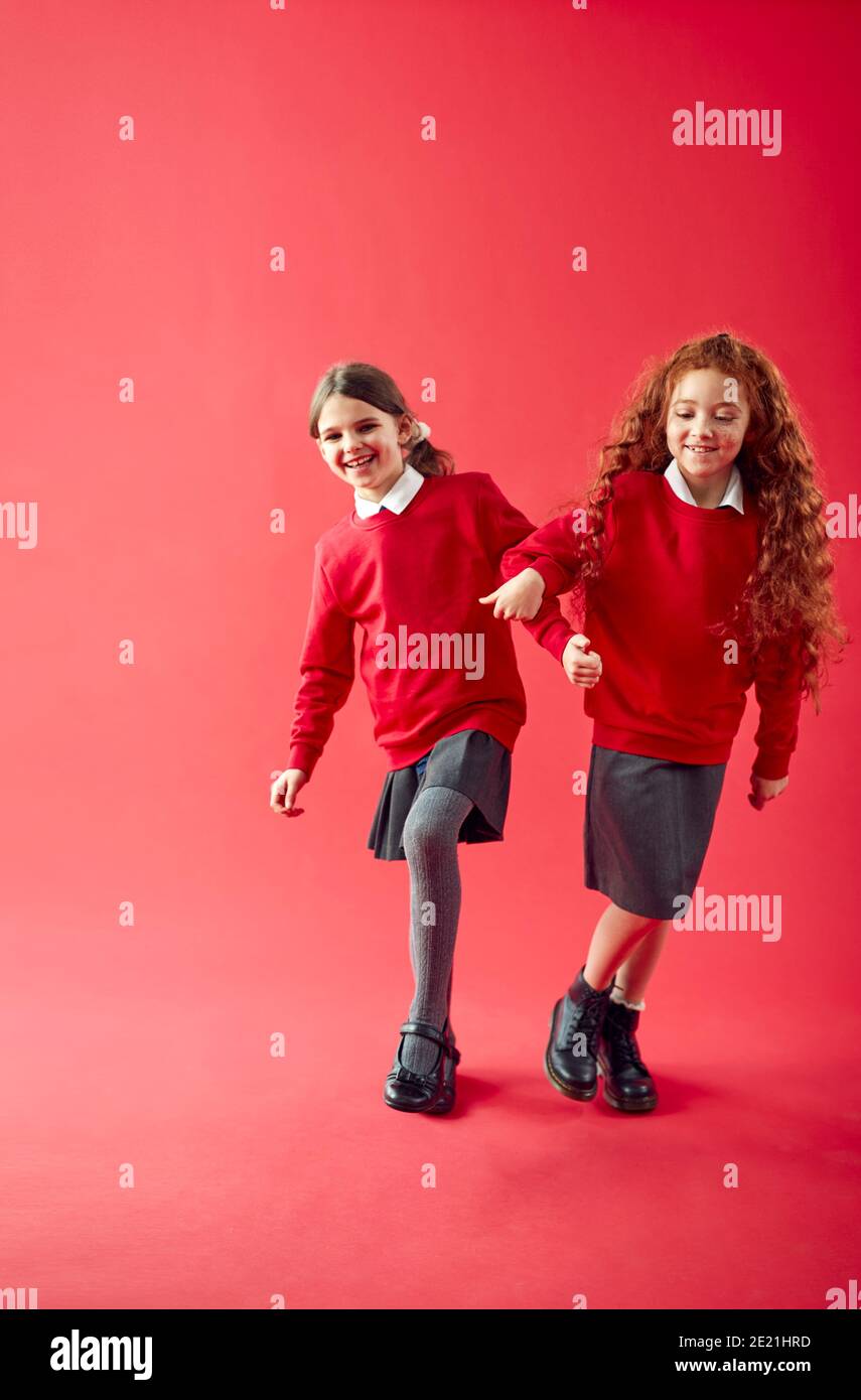 Mixed girls wearing school uniform hi-res stock photography and images ...