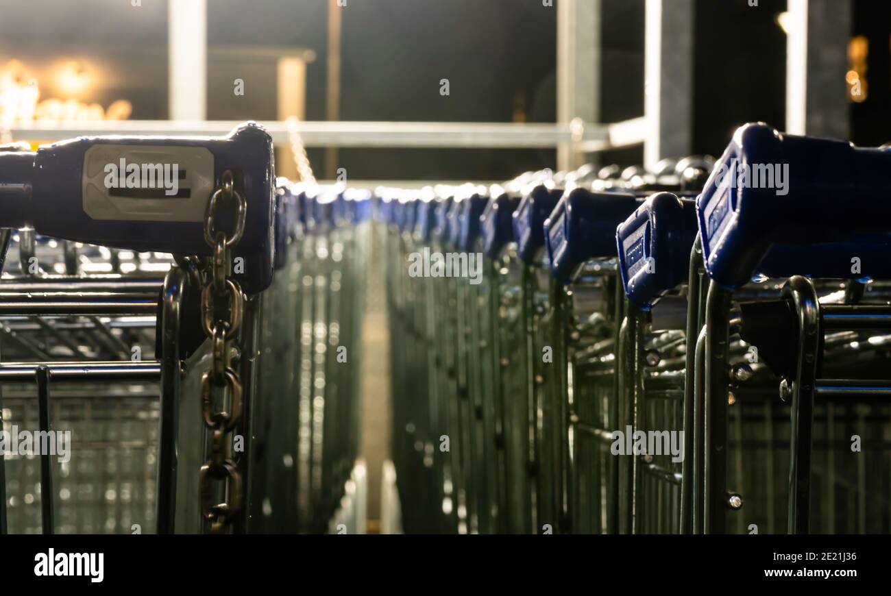 Shopping carts parked and stacked in a shed Stock Photo - Alamy