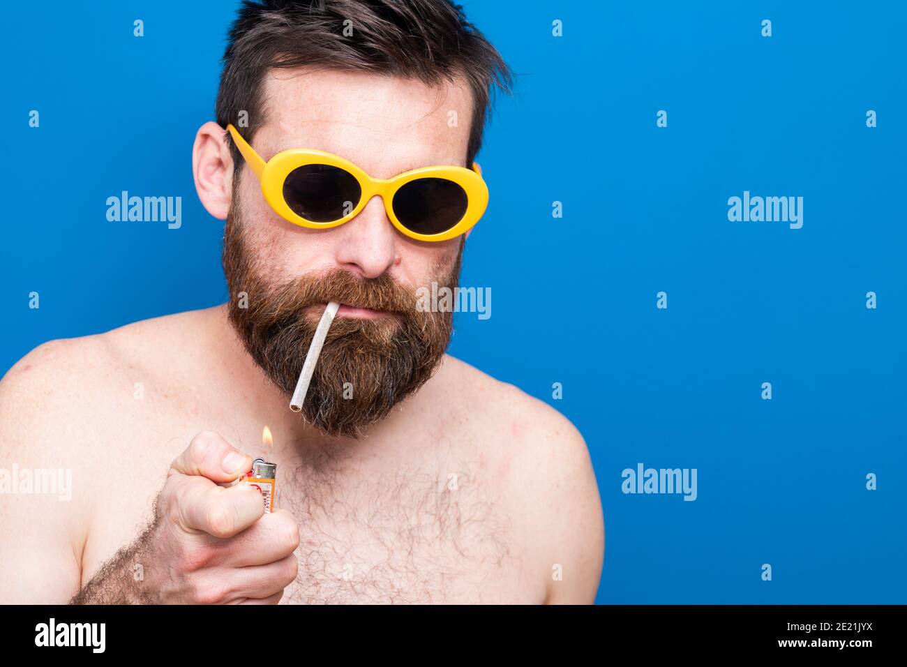 funny young man with sunglasses and cigarette Stock Photo - Alamy