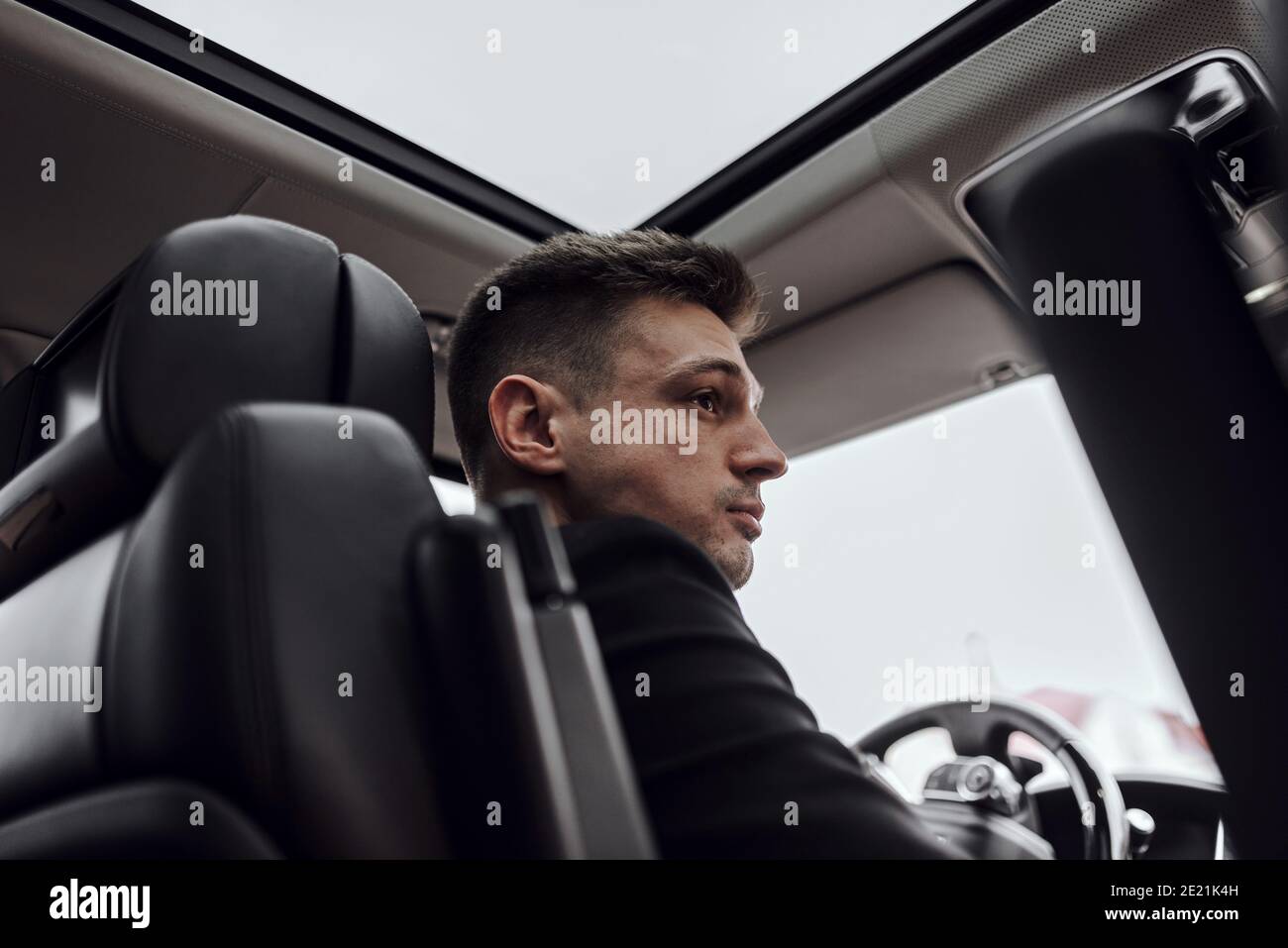 Cropped photo of young businessman renting car. Rent and trade-in concept Stock Photo
