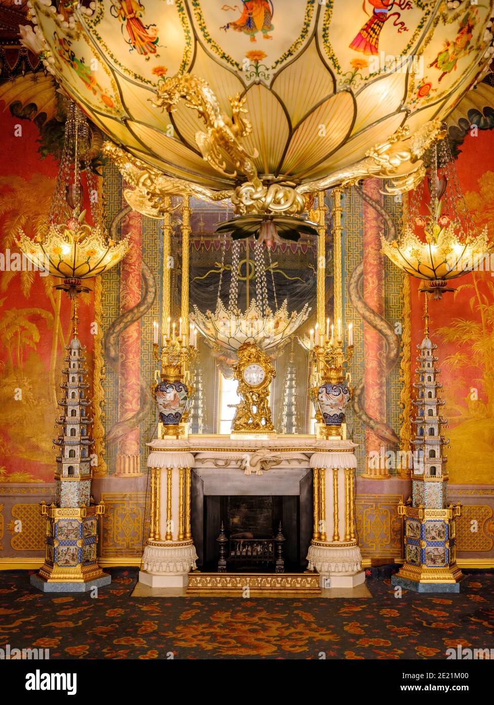 The Royal Pavilion Brighton: The music room during the exhibition of the Royal Colection a Prince's Treasure on loan 2020 and 2021. Featuring pagodas seen here either side of the fireplace. Stock Photo