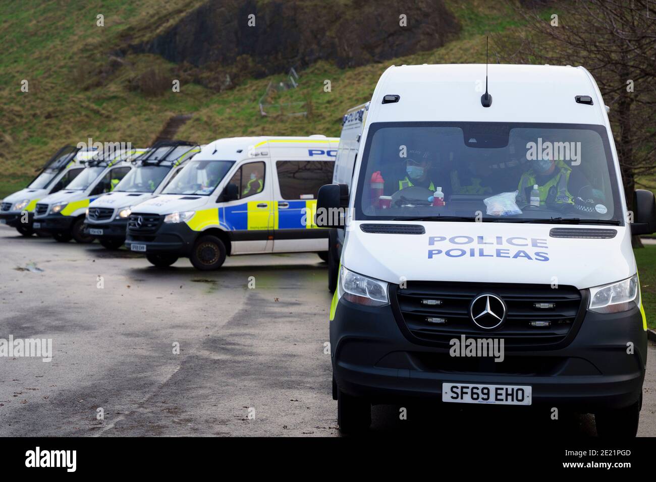 Edinburgh, Scotland, UK. 11 January 2021. Protester arrested in violent scenes at anti lockdown demonstration at Scottish Parliament in Edinburgh today. Several protesters took part but  a heavy and aggressive police presence prevented demonstration and planned march to Bute House. During national Covid-19 lockdown such protests are illegal and police advised people not to attend the demonstration. Iain Masterton/Alamy Live News Stock Photo