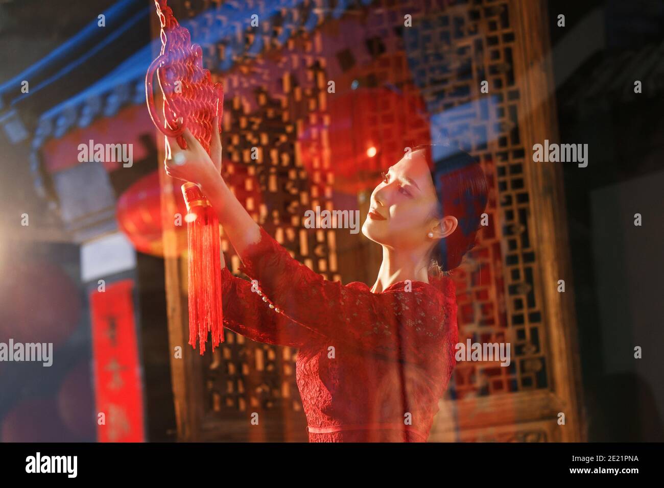 The young woman to hang Chinese knot Stock Photo Alamy