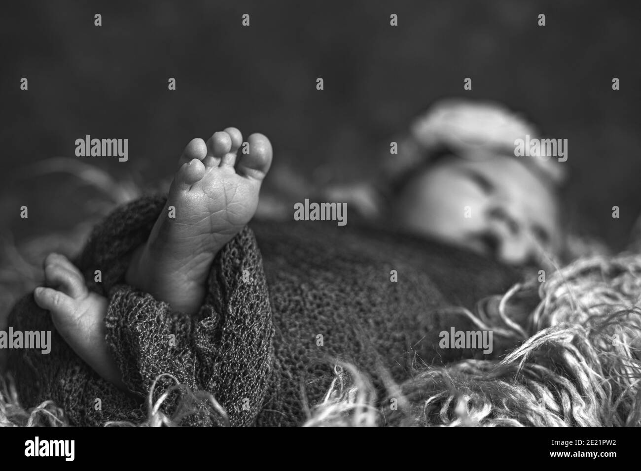 Black and white image of a newborn baby girl with copy space Stock Photo