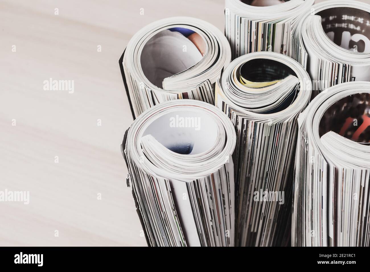 Glossy magazine with pages rolled Stock Photo Alamy