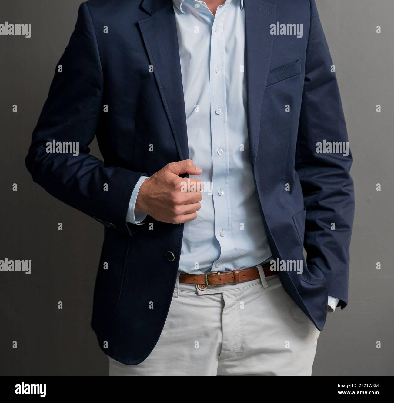 Man in a dark blue suit with a light 