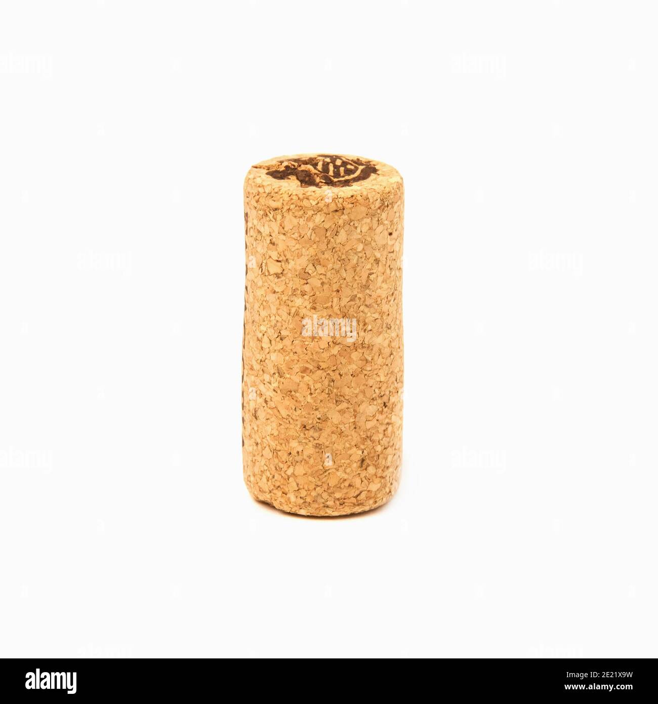 A beige natural cork from a wine bottle isolated on white background Stock Photo