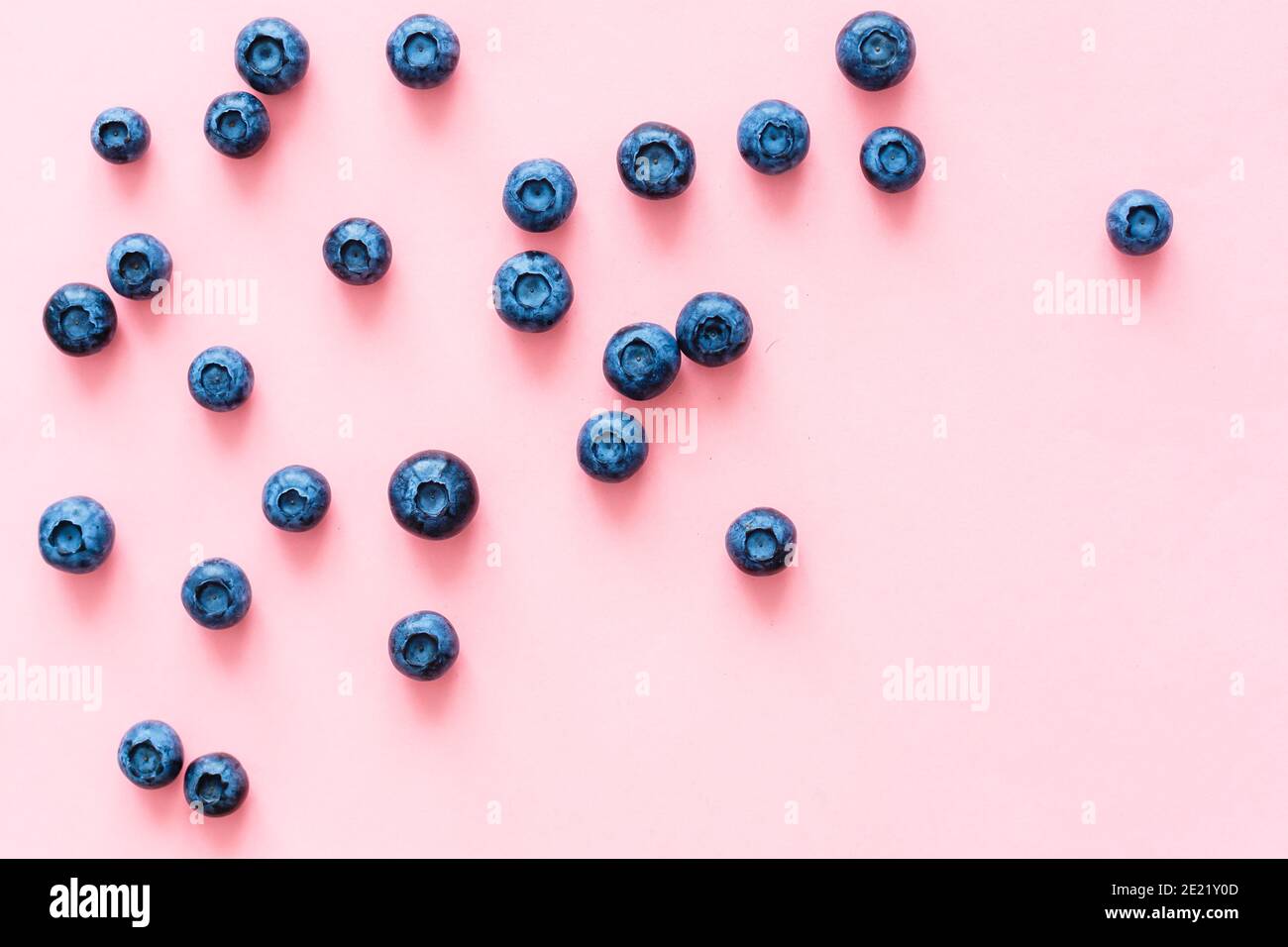 blueberries on pink background. Top view. Flat lay Stock Photo