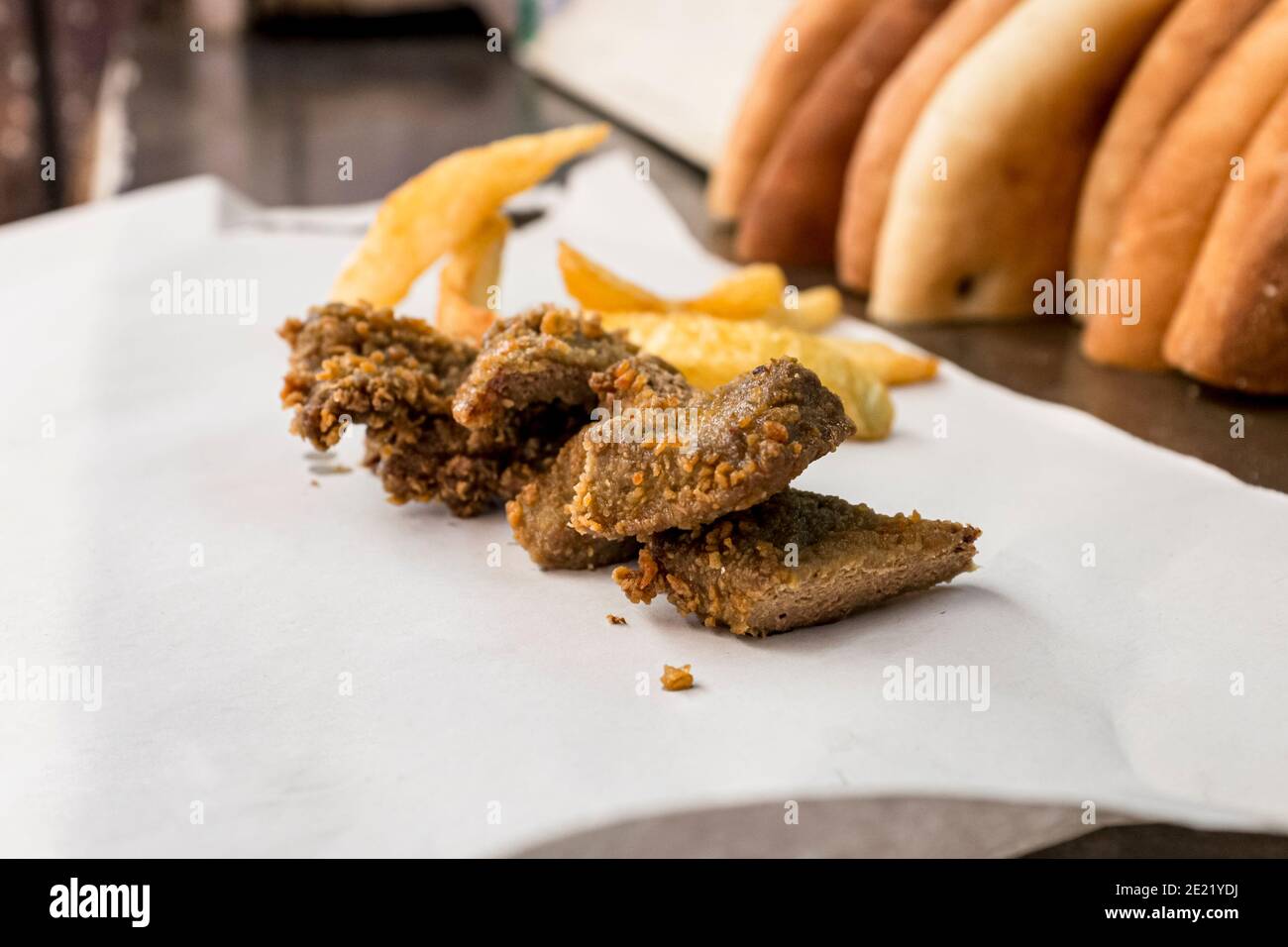 Calves' livers, crumbed and fried, and served with fries Stock Photo Alamy
