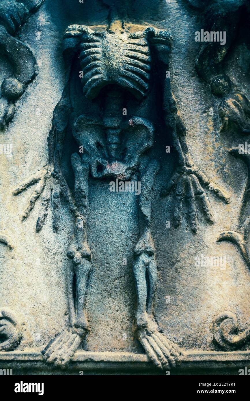 Human skeleton on vintage scottish gravestone in Edinburgh cemetery Stock Photo