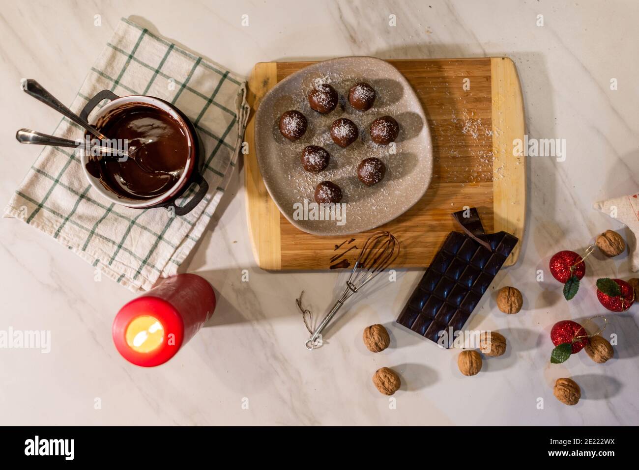 Top view of Christmas desserts, a bowl of melted chocolate on the table ...