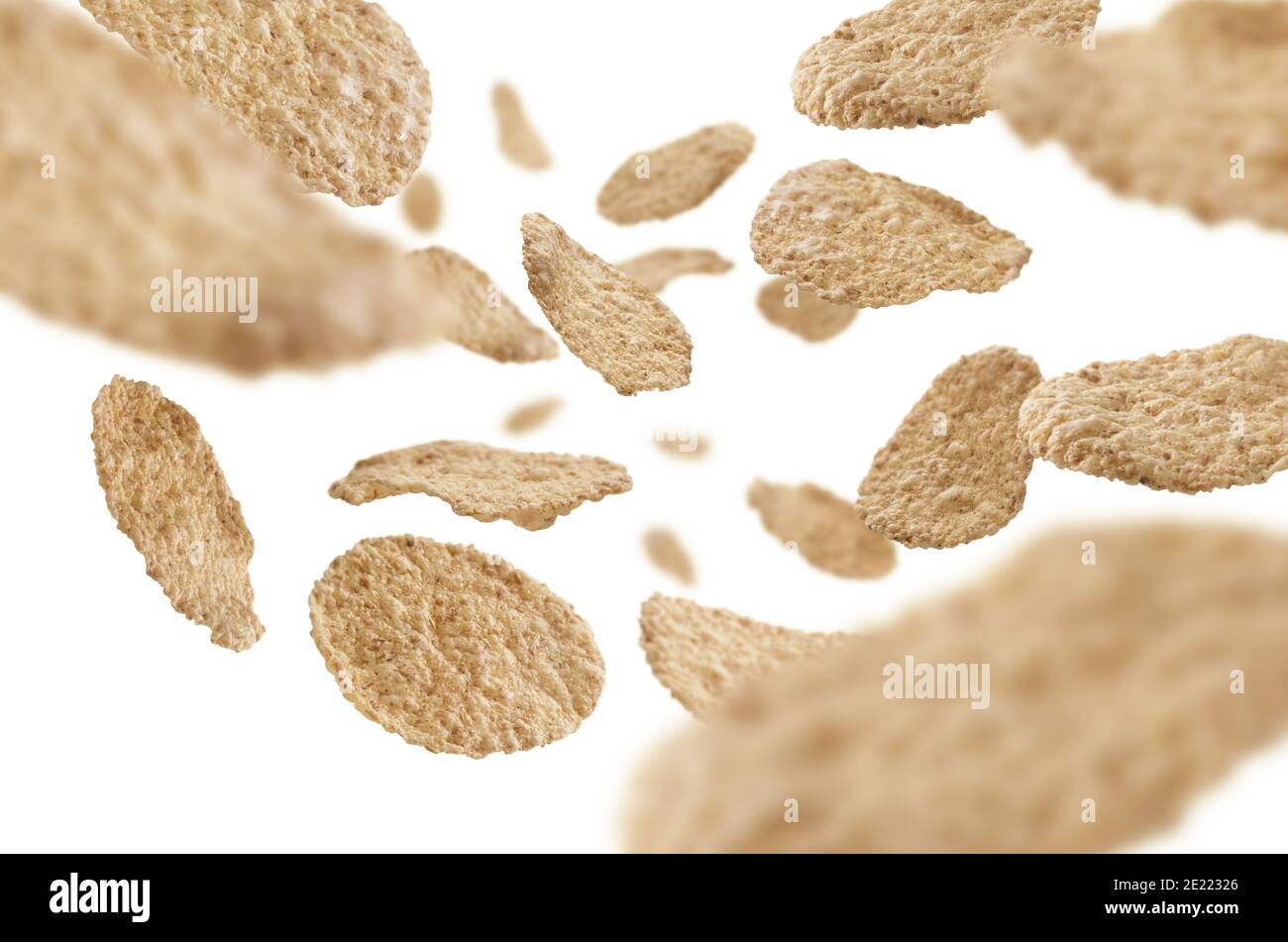 Rice flakes levitate on a white background Stock Photo - Alamy