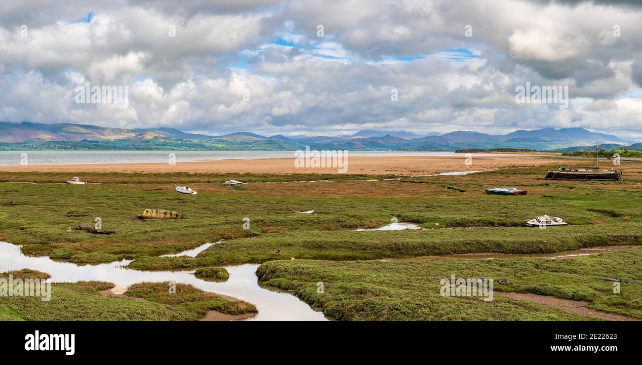 Boats in the grass, with clouds over the Lake District National Park in