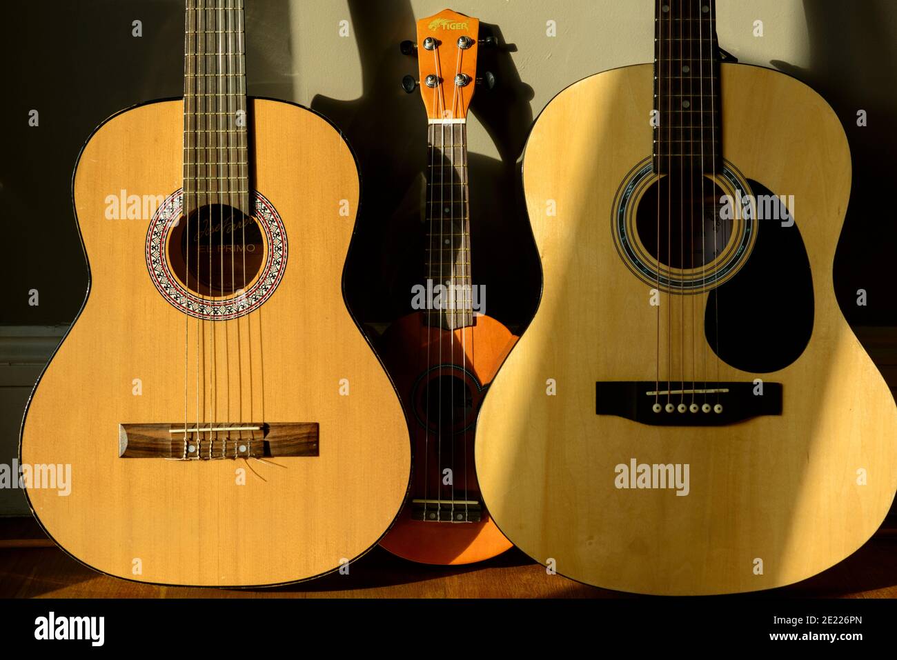 Acoustic guitars and ukulele Stock Photo Alamy