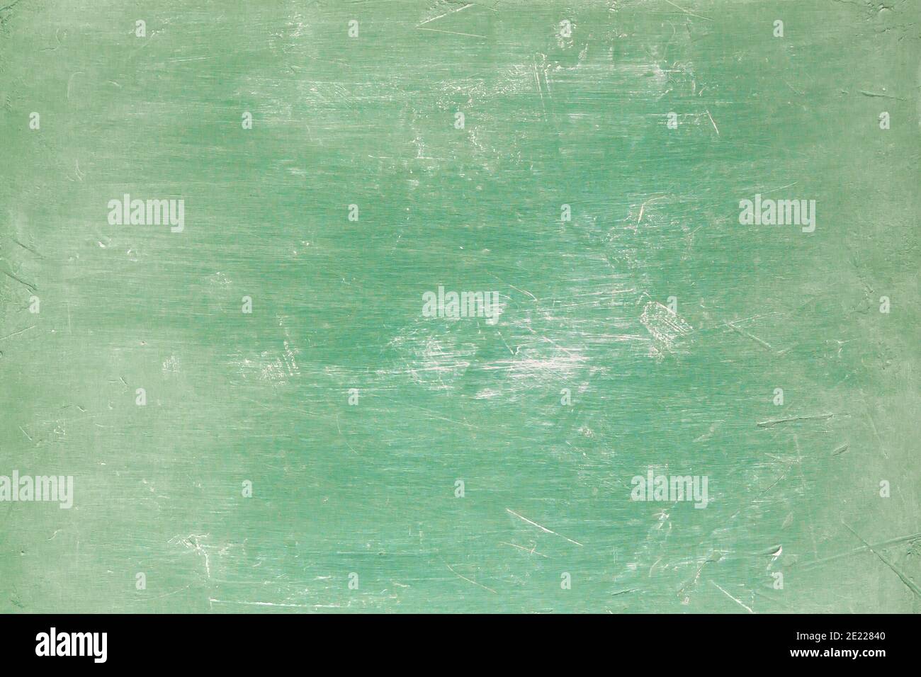 Old green painted worn backdrop, grunge background or texture Stock Photo