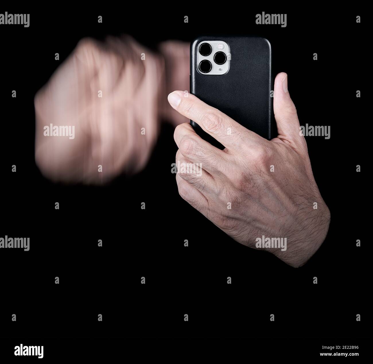 Hand scrolling gesture on smartphone screen with black cover and black background Stock Photo